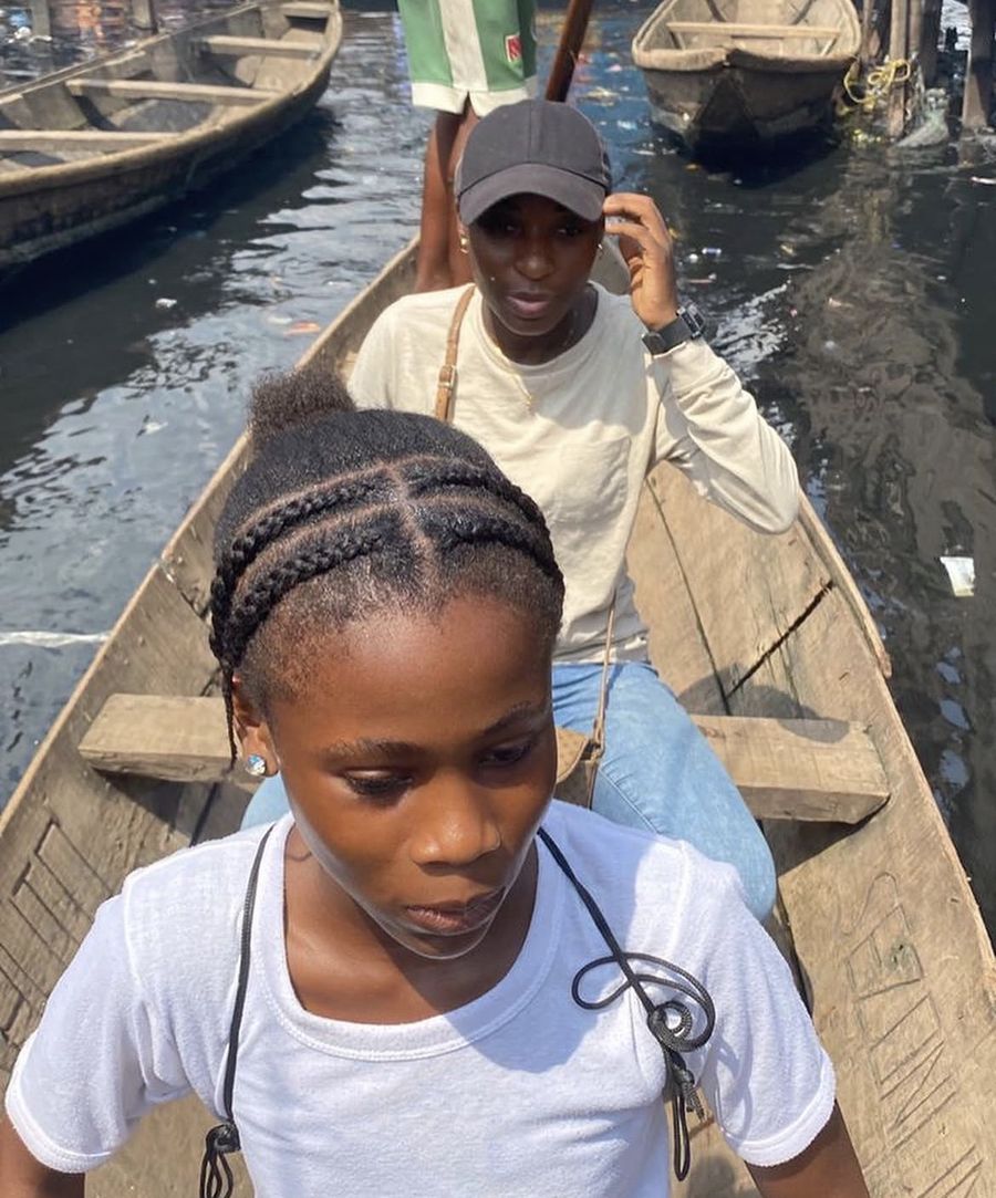 Travelling by canoe to deliver books to a waterside school