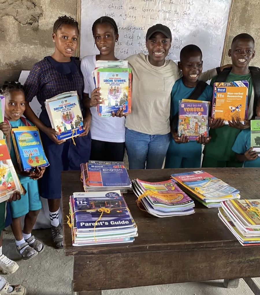 Handing over textbooks at a Book Drive